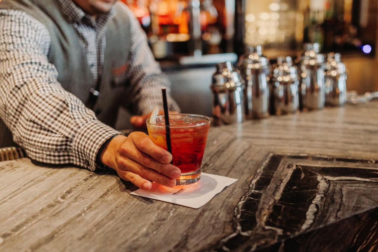 Отель The Westin New York At Times Square Экстерьер фото A man drinking a cocktail